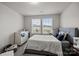 Comfortable bedroom with neutral tones, lots of natural light, and a clean design at 12205 Gambrell Dr, Charlotte, NC 28278