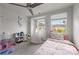 Charming ' bedroom with a cozy bed, playful decor, and lots of natural light at 12205 Gambrell Dr, Charlotte, NC 28278