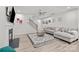 Bright living room featuring a fireplace, staircase, modern decor, and wood-look flooring at 12205 Gambrell Dr, Charlotte, NC 28278