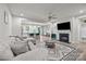 Open-concept living room with a fireplace, modern decor, and eat-in kitchen at 12205 Gambrell Dr, Charlotte, NC 28278