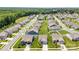 Panoramic aerial view of a well-planned residential community with lush green lawns and orderly street layout at 128 Asher Ln, Mooresville, NC 28115