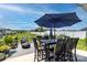 Spacious back deck features an outdoor dining set and green views perfect for entertaining at 128 Asher Ln, Mooresville, NC 28115