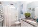 Well-lit bathroom with granite countertop, integrated sink, and combination tub and shower at 128 Asher Ln, Mooresville, NC 28115