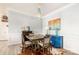 Stylish dining room with hardwood floors, elegant lighting, and cozy seating for Gathering meals at 128 Asher Ln, Mooresville, NC 28115