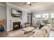 Comfortable living room features a fireplace, large windows, and elegant decor at 128 Asher Ln, Mooresville, NC 28115