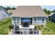 An aerial view shows a backyard deck complete with a dining set and gas grill at 128 Asher Ln, Mooresville, NC 28115