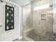 Modern tiled shower with built-in bench and glass enclosure, plus convenient niche for toiletries at 128 Asher Ln, Mooresville, NC 28115