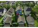 Overhead shot of the home showcasing a well-kept yard with patio and proximity to detached garage at 14034 Holly Springs Dr, Huntersville, NC 28078