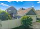 Exterior view showcasing a backyard, garage, and well-maintained landscaping at 14034 Holly Springs Dr, Huntersville, NC 28078