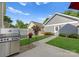 Landscaped backyard with stainless steel grill, patio, green lawn and lovely shrubs at 14034 Holly Springs Dr, Huntersville, NC 28078