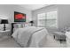 Cozy bedroom featuring plush carpet, a ceiling fan, and ample natural light, creating a warm and inviting space at 14034 Holly Springs Dr, Huntersville, NC 28078