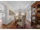 Elegant dining room featuring hardwood floors, natural light, and space to entertain friends and Gathering at 14034 Holly Springs Dr, Huntersville, NC 28078