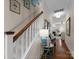 Inviting entryway with hardwood floors and staircase leading to the upper level, creating a warm first impression at 14034 Holly Springs Dr, Huntersville, NC 28078