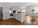 Spacious open concept kitchen featuring white cabinets and stainless steel appliances at 14034 Holly Springs Dr, Huntersville, NC 28078