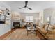 Inviting living room with a fireplace, large windows, and comfortable furnishings at 14034 Holly Springs Dr, Huntersville, NC 28078