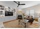 Cozy living room featuring a fireplace, custom built-ins, and stylish decor at 14034 Holly Springs Dr, Huntersville, NC 28078