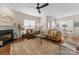 Bright living room with hardwood floors, fireplace, and comfortable seating area at 14034 Holly Springs Dr, Huntersville, NC 28078