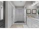 The main bathroom features marble countertops, a walk-in shower, and generous space for a relaxing lifestyle at 14034 Holly Springs Dr, Huntersville, NC 28078