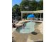 Shallow pool area for children, with a blue umbrella-shaped fountain in the center at 14034 Holly Springs Dr, Huntersville, NC 28078