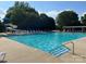Large community pool area with a slide, plenty of lounge chairs, and a staircase for easy access at 14034 Holly Springs Dr, Huntersville, NC 28078