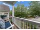 Relaxing porch view with a cozy rocking chair and neighborhood scenery at 14034 Holly Springs Dr, Huntersville, NC 28078