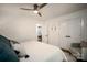 Cozy bedroom featuring a ceiling fan, closet space, and a comfortable armchair at 1408 Rinehart Ct, Charlotte, NC 28270