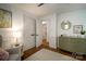 Bright bedroom features hardwood floors, wainscoting and closet at 1408 Rinehart Ct, Charlotte, NC 28270
