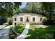 Charming white brick home featuring a well-manicured lawn and elegant front entrance at 1408 Rinehart Ct, Charlotte, NC 28270