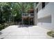 Exterior view of the home featuring a two-story deck and a white brick facade at 1408 Rinehart Ct, Charlotte, NC 28270