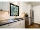 Well-lit kitchen with stainless steel appliances, modern cabinets, and stone countertops at 1408 Rinehart Ct, Charlotte, NC 28270