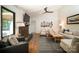Cozy living room with a fireplace, vaulted ceiling, hardwood floors, and stylish decor at 1408 Rinehart Ct, Charlotte, NC 28270