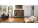 Inviting living room features a fireplace, hardwood floors, and abundant natural light at 1408 Rinehart Ct, Charlotte, NC 28270