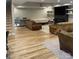 Spacious finished basement with hardwood floors, featuring an electric fireplace and lounge area at 1427 Kinks Ln # 47, Maiden, NC 28650