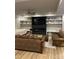 Finished basement with hardwood floors showcasing entertainment center, couch, and built-in shelving at 1427 Kinks Ln # 47, Maiden, NC 28650