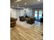Finished basement featuring wood-look floors, recessed lighting, and cozy seating area with armchairs at 1427 Kinks Ln # 47, Maiden, NC 28650