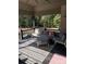 Comfortable covered patio with ample seating and a beautiful view of the surrounding trees at 1427 Kinks Ln # 47, Maiden, NC 28650