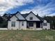 Charming, modern home with white brick, black trim, and lush green lawn at 1427 Kinks Ln # 47, Maiden, NC 28650
