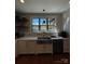 Beautifully lit kitchen with a stainless steel farm sink and a view of the backyard at 1427 Kinks Ln # 47, Maiden, NC 28650