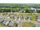 Aerial view of neighborhood with wooded lots backing to a lake at 14407 Cardwell Hill Ln, Charlotte, NC 28278