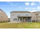 This home features a covered back patio and a fenced in yard at 14407 Cardwell Hill Ln, Charlotte, NC 28278