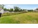 The spacious backyard features a black aluminum fence and backs up to a lake at 14407 Cardwell Hill Ln, Charlotte, NC 28278