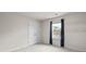 This bedroom has soft gray carpet, a double door closet, natural lighting, and light gray paint at 14407 Cardwell Hill Ln, Charlotte, NC 28278