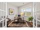 Bright office space with a window, desk, decor, and french doors at 14407 Cardwell Hill Ln, Charlotte, NC 28278