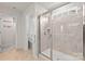 Modern bathroom featuring a walk-in shower with glass door and tiled walls at 14407 Cardwell Hill Ln, Charlotte, NC 28278