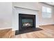 Close up of a modern fireplace with clean lines, creating a focal point in the room at 1441 Mccollum St, Monroe, NC 28112