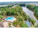 Aerial view of community pool, lake, playground and picnic areas with a dense forest in background at 1467 Tranquility Blvd, Lancaster, SC 29720