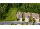 Aerial shot of two homes with wooded backyards, neatly maintained lawns, and driveways that line up to the street at 1467 Tranquility Blvd, Lancaster, SC 29720