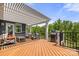 Inviting back deck features a pergola, outdoor seating, and a grill, perfect for entertaining at 1467 Tranquility Blvd, Lancaster, SC 29720