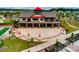 Aerial view showcases a community center with outdoor seating, manicured lawns, and landscaping at 1467 Tranquility Blvd, Lancaster, SC 29720