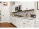 Well-equipped kitchen with white cabinets, granite countertops, stainless steel appliances and a gas cooktop at 1467 Tranquility Blvd, Lancaster, SC 29720